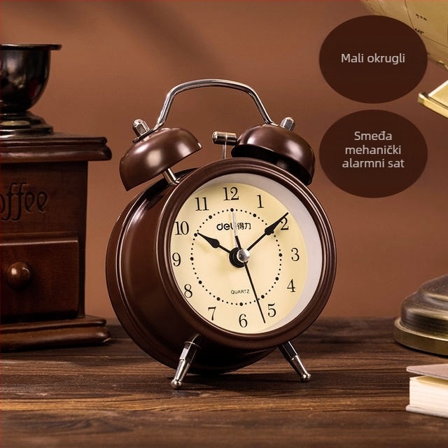 Budilica Deli 9024: svijetleće kazaljke, tih rad; analognni prikaz s brojevima, mehanički pogon, baterijsko napajanje