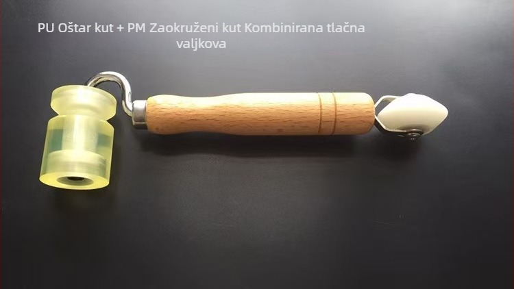 Dvostrani pritiskujući valjak s drškom od bukovine, nylonim valjkom i galvaniziranim nosačem, za postavljanje tapeta