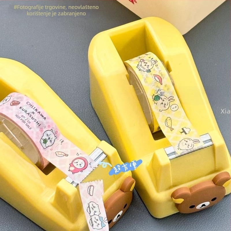 Slatki crtani dizajn stolni rezač trake s protukliznom bazom (Model 887; Materijal: Plastika; Širina trake ≤ 18 mm; Promjer osovine trake > 25 mm; Namijenjeno studiju)