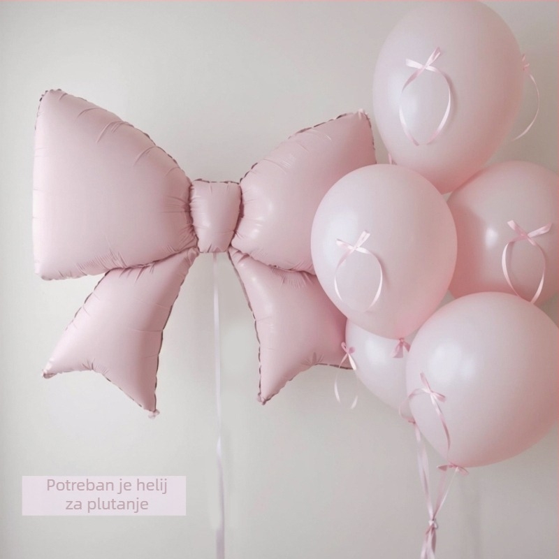 Mat ružičasti balon u obliku mašne i srca od aluminijske folije – dekoracija za fotografiranje na dječjem rođendanu