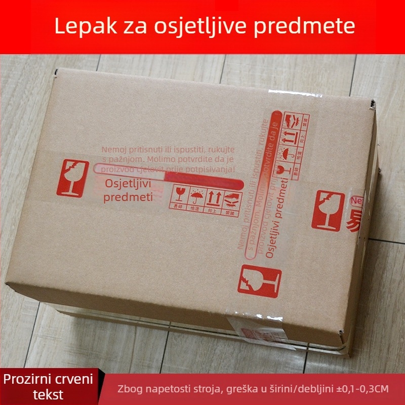 Lenta za pakiranje krhkih artikala uz upozorenje, BOPP film osnove, hidrokloloidno ljepilo, debljina 52 μm, mogućnost rezanja alatom za rezanje, namijenjena zatvaranju i pakiranju