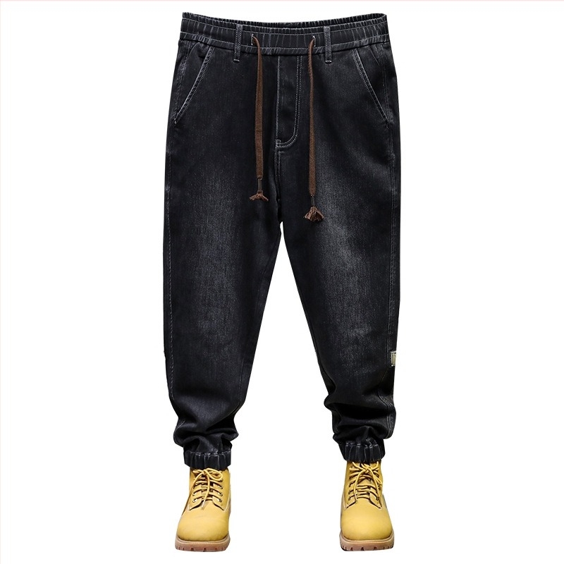 Muške denim jogger hlače — opušteni harém kroj, srednje visoki pojas, šnira i elastični pojas, mješavina pamuka/poliester/elastana, jesen 2025