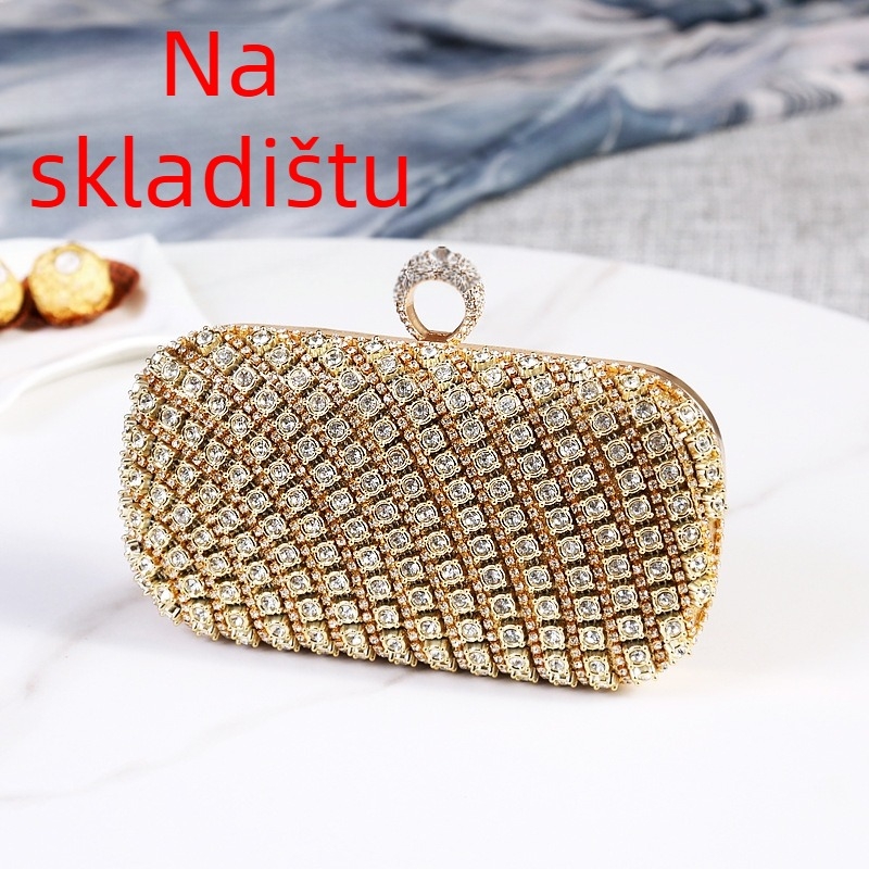 Večernja kutijasta torbica, metalno tijelo, podstava od sintetičke kože, ovalni oblik, trodimenzionalni vanjski dizajn, zatvaranje zasunom.
