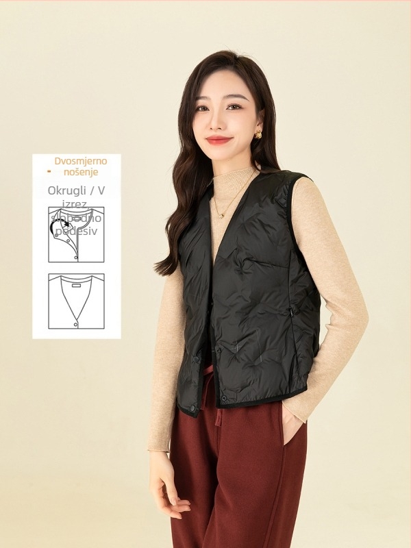 Ženska puffer vest s struknim prilagodom – punilo: bijelo kačje perje; udio perja 80–85%; materijal: poliester; V-izrez