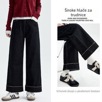 Trudničke traperice s fleece-om, širokog kroja, visokim strukom, duljina 9/10, izvezen retro stilom.