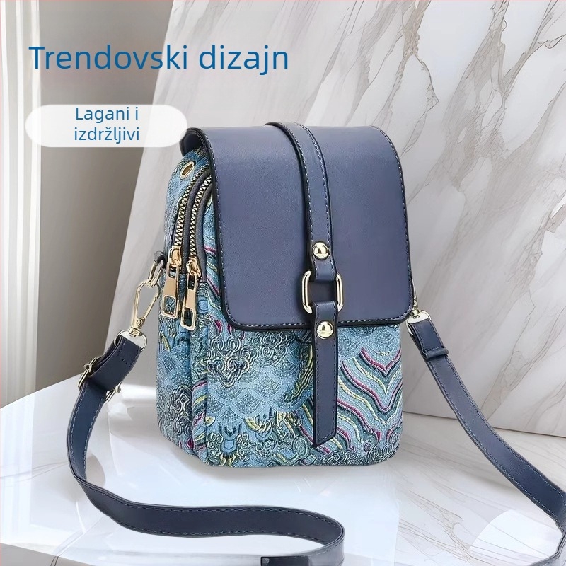 Crossbody torba od PU kože, vertikalnog kvadratnog oblika s poklopcem; zatvaranje poklopcem; unutarnji pretinci: džep sa zatvaračem, džep za mobitel, ID džep, laminirani džep; podstava od poliestera; jedan naramenica; brend Easy