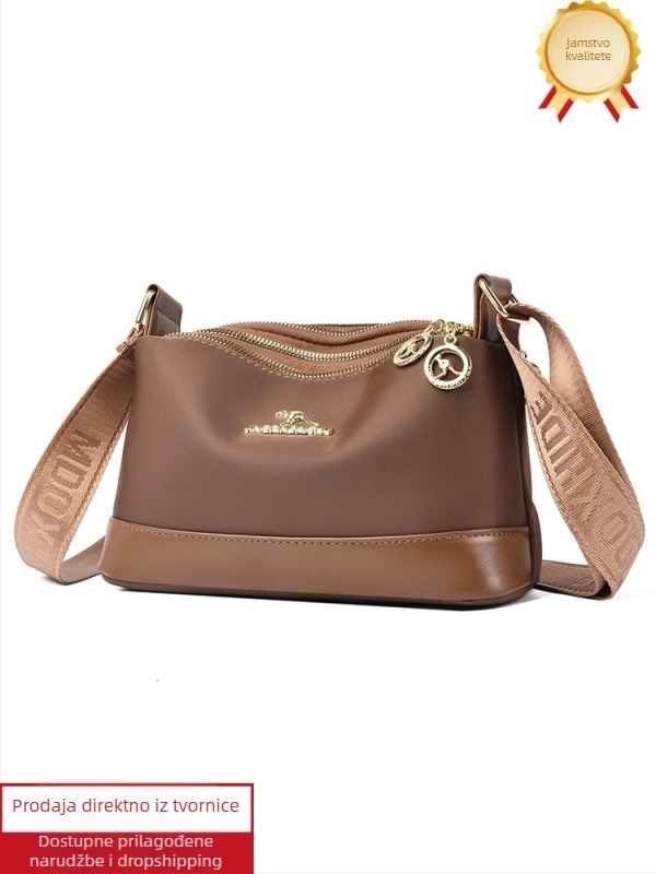 Ženska crossbody torba od Oxford platna, horizontalno kvadratnog oblika, zatvaranje na zip, poliester podstava, unutarnji džepovi: džep sa zipom, džep za telefon i džep za ID