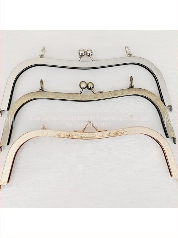 Dodatak za torbe — okvir s vijčanim otvorom, 27 udubljenih struka, ugravirana okrugla glava perle, dizajn bucket-ear. Materijal: željezo. Šifra proizvoda: 000306. Haowen luggage accessories factory. Jesen 2024. Dodatak za torbe.