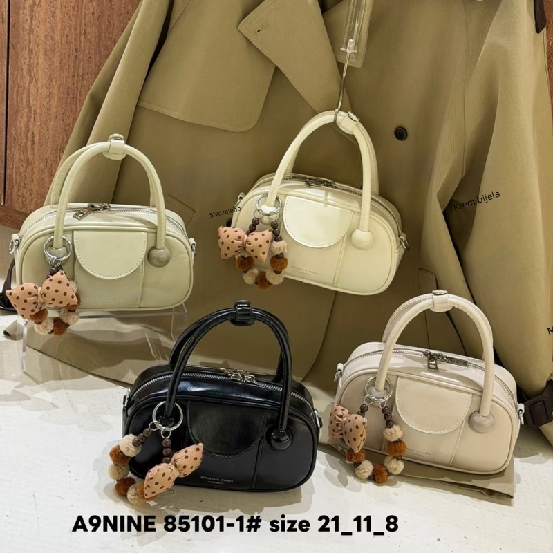 Crossbody torba u urban minimalističkom stilu, PU koža, bowling bag stil, horizontalno pravokutni oblik, zip zatvarač