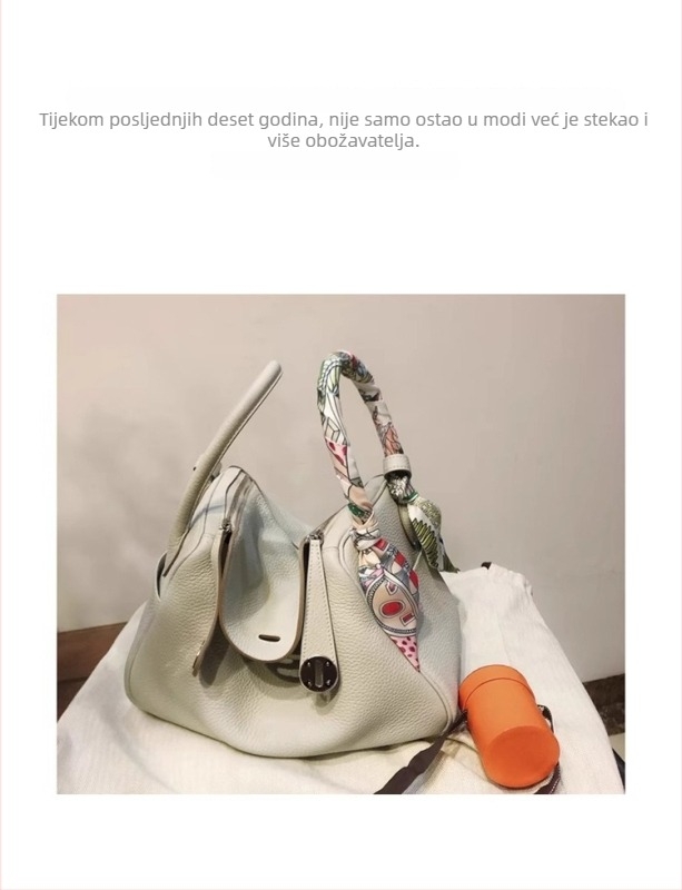 Ženska torba Doctor od prave kože s remenom za nošenje preko ramena — materijal: prava koža; podstava: kravlja koža; zatvaranje: zatvarač; laminirani unutarnji pretinac; mekana koža