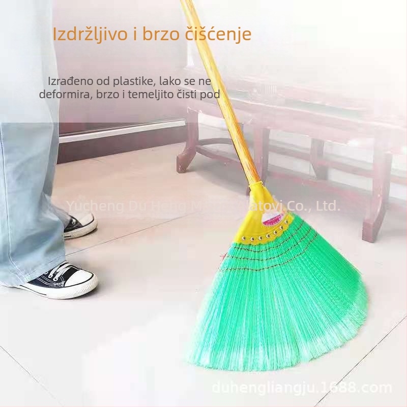 Debela valovita žičana metla s drvenom drškom i šarenom glavom metle