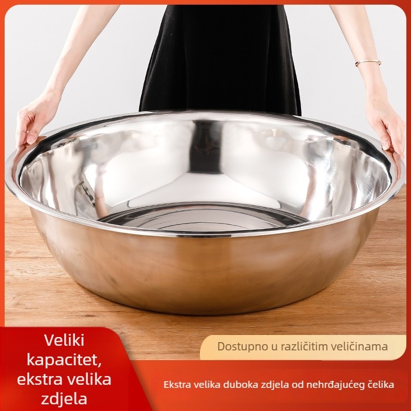 Velika posuda od nehrđajućeg čelika s debelim stijenkama i zakrivljenim rubom, pogodna za pranje povrća i rublja.