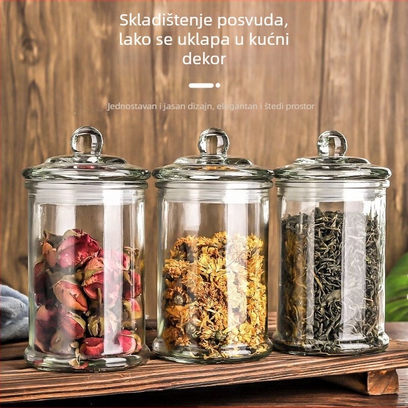 Prozirna staklena posuda s hermetičnim poklopcem za čaj i suhe žitarice u kuhinji
