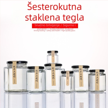 Šesterokutno staklena posuda s poklopcem, zatvorena, prehrambene kvalitete, mala kapaciteta, pogodna za pastu od limuna, med i čili džem