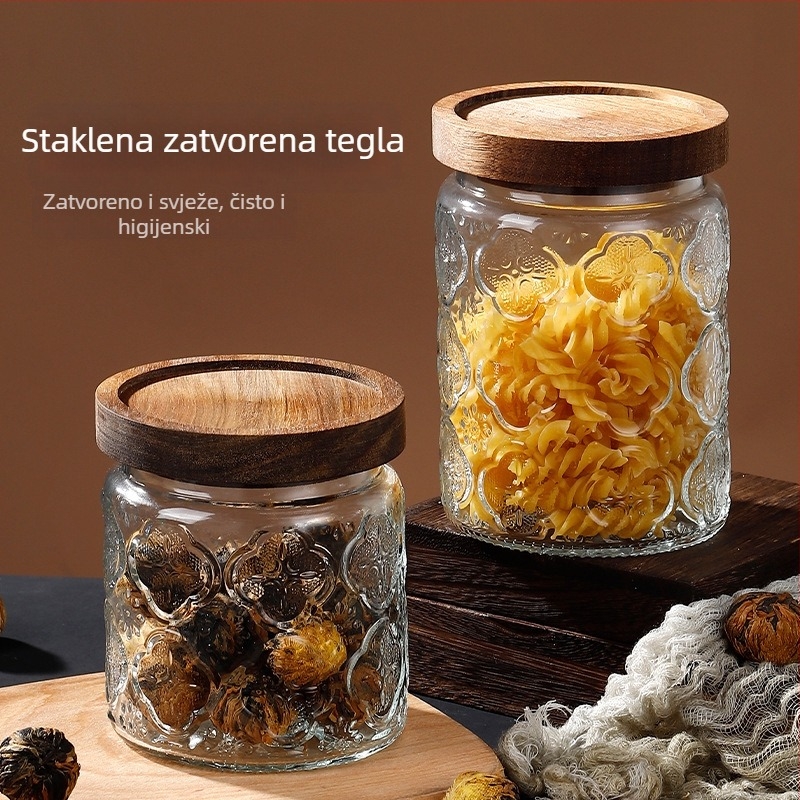 Staklena posuda za skladištenje s prozirnim tijelom i reljefnim motivom Begonije, zatvara se, za grickalice i čaj