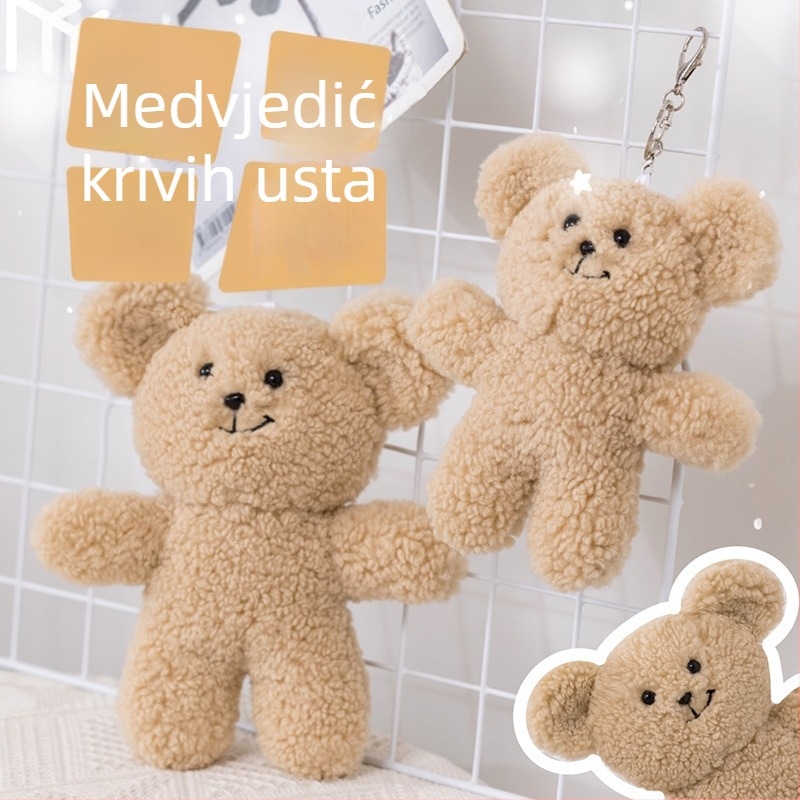 Plišani medvjedić s izkrivljenim smiješkom – privjesak za torbu i ključeve