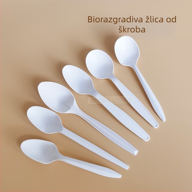Debljani bijeli jednokratni pribor (nož, vilica, žlica) od kukuruznog škroba; biološki razgradivo.