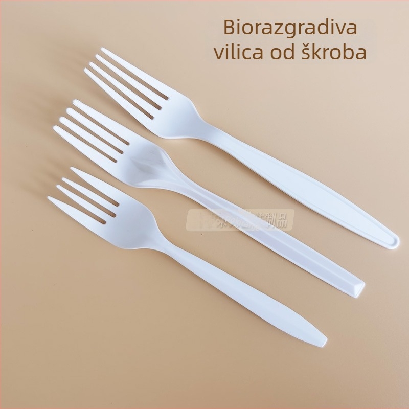 Debljani bijeli jednokratni pribor (nož, vilica, žlica) od kukuruznog škroba; biološki razgradivo.