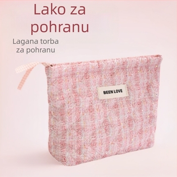 Lagani putni kozmetički neseser s organizatorom za četkice za make-up, kompaktna ručna torba, moderan minimalistički dizajn.