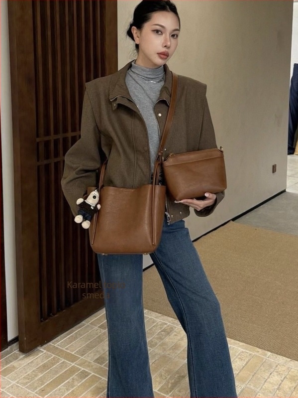 Ženska bucket torba s nišnim dizajnom, minimalistička kožna torba, jesen-zima 2025, retro urbani crossbody torba s jednim remenom