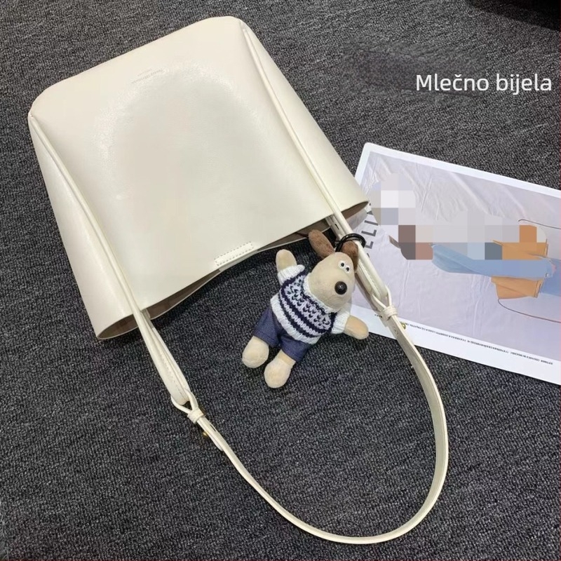 Ženska bucket torba s nišnim dizajnom, minimalistička kožna torba, jesen-zima 2025, retro urbani crossbody torba s jednim remenom