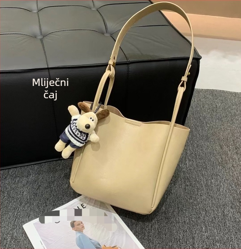 Ženska bucket torba s nišnim dizajnom, minimalistička kožna torba, jesen-zima 2025, retro urbani crossbody torba s jednim remenom
