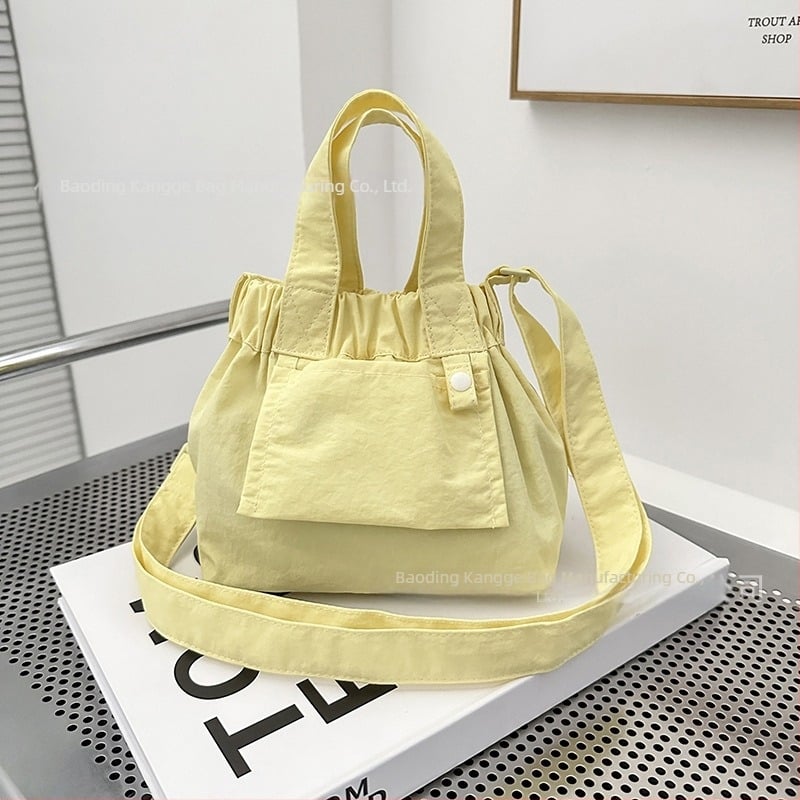 Jesenska 2025 mini najlonska bucket crossbody torbica za žene sa blokovima boja