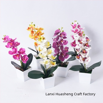 Umjetna Phalaenopsis orhideja u loncu za kućnu i uredsku dekoraciju