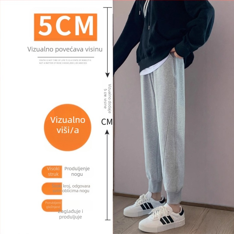 Ženske sportske hlače s fleece podstavom, sive boje, za jesen-zimu, ravni kroj, opuštene nogavice, manžetama pri gležnju, tople i udobne.