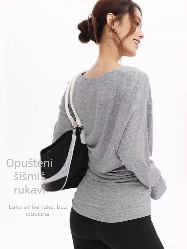 Ženski T-shirt s dugim rukavima i velikim U-izrezom, prekriva bokove, pogodna za sport, fitness i jogu; širok kroj, naglašava struk i vizualno sužava siluetu.