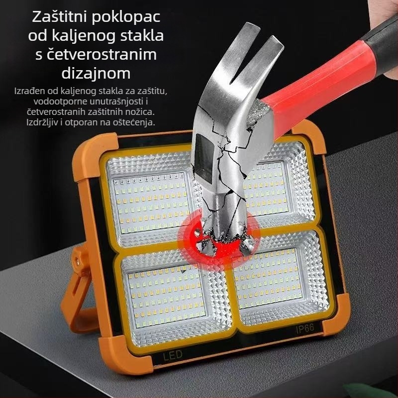 Vanjski solarni LED floodlight, prijenosni s mogućnošću punjenja; za kampiranje, putovanja i hitne situacije; kompakna žuta svjetlost.