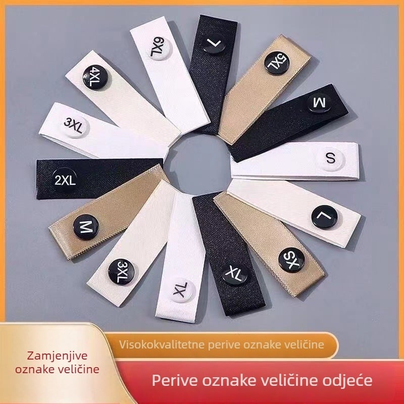 Set oznaka za odjeću za njegu: oznaka za pranje, razni stilovi oznaka veličine, oznaka za ovratnik, gumbi, okrugle kopče veličine i kopče koda veličine.