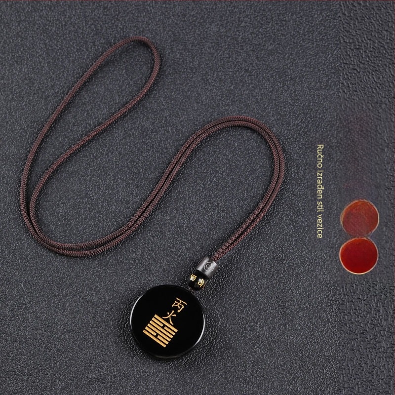 Gravirani obsidijan privjesak s vodnim elementom i energetski talisman
