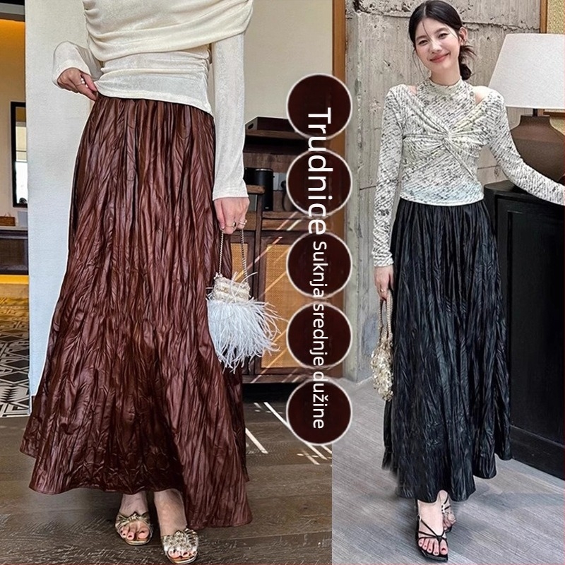 Trudničarska kožna suknja — jesenji francuski stil, retro elegantna, nepravilni plisirani detalji, srednja duljina, A-linija