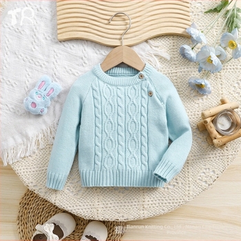 Eladó új, kék színű, kerek nyakú, csavart gombos, hosszú ujjú, kötött pulóver kisfiúknak