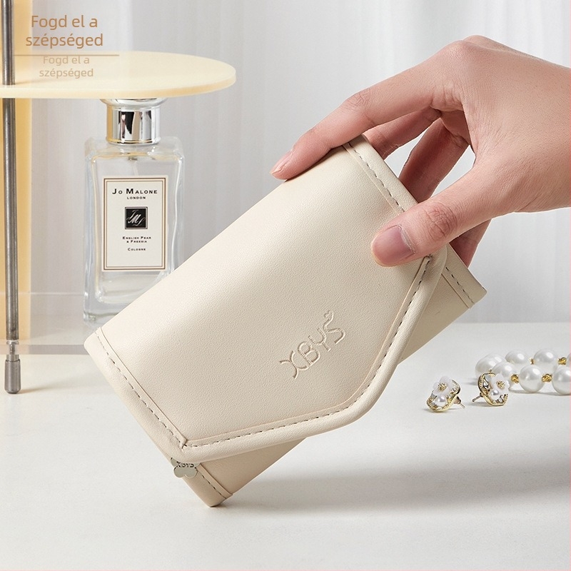 Ékszeres kozmetikai táska Női 2024 új hordozható kézitáska utazó nyaklánc fülbevaló bőrápoló mosó TPU tárolótáska