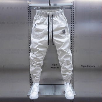 Tavaszi és őszi új férfi lezser nadrág koreai stílusú, gyorsan száradó, laza szárú, divatos, egyszínű, minden lábra illeszkedő nadrág