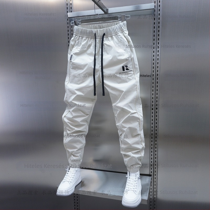 Tavaszi és őszi új férfi lezser nadrág koreai stílusú, gyorsan száradó, laza szárú, divatos, egyszínű, minden lábra illeszkedő nadrág