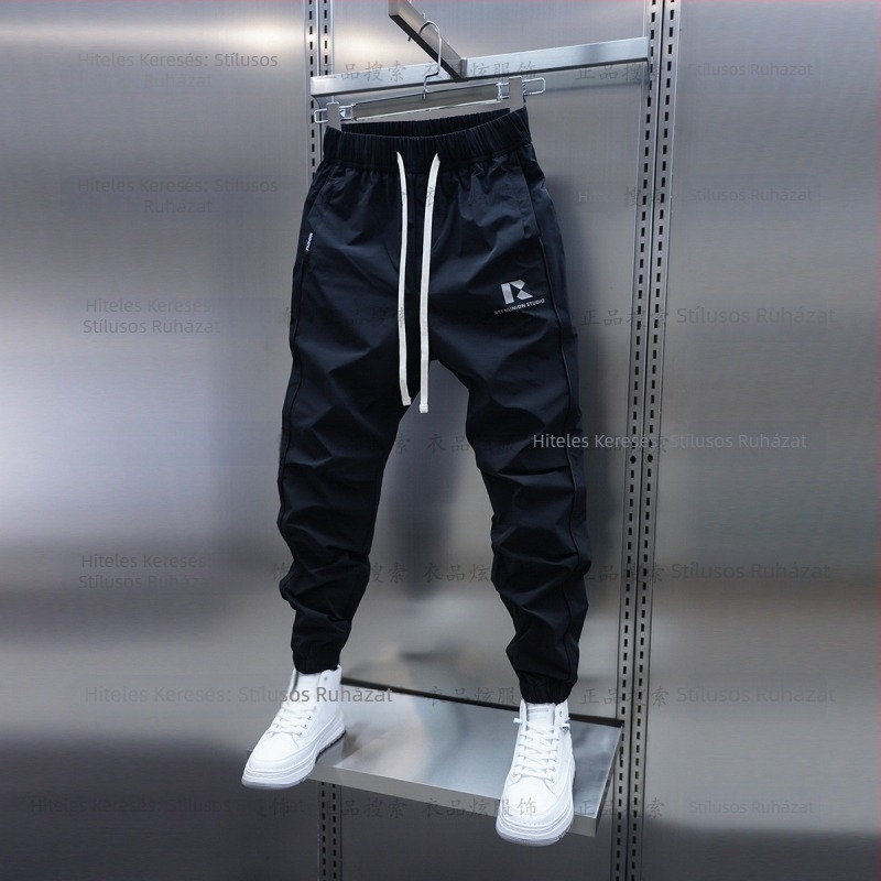 Tavaszi és őszi új férfi lezser nadrág koreai stílusú, gyorsan száradó, laza szárú, divatos, egyszínű, minden lábra illeszkedő nadrág