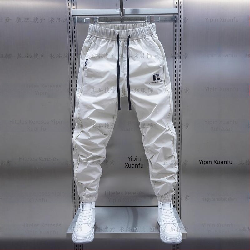 Tavaszi és őszi új férfi lezser nadrág koreai stílusú, gyorsan száradó, laza szárú, divatos, egyszínű, minden lábra illeszkedő nadrág