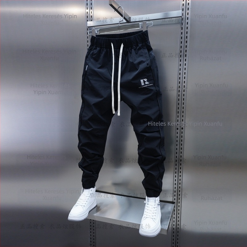 Tavaszi és őszi új férfi lezser nadrág koreai stílusú, gyorsan száradó, laza szárú, divatos, egyszínű, minden lábra illeszkedő nadrág