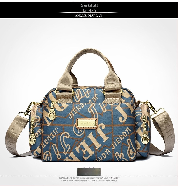 Női vízálló Oxford anyagú táska, kompakt négyszöges alak, cipzáras nyitás, belső zsebek (telefon, ID), poliészter bélés