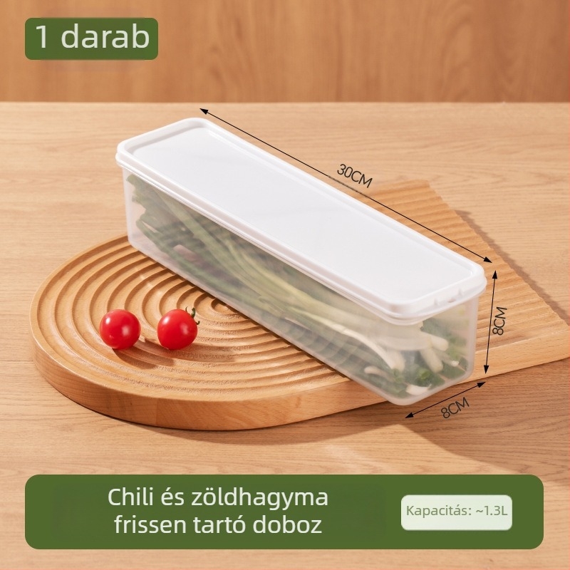 Hosszú, átlátszó hűtőszekrényben tároló doboz korianderrel, teljes újhagyma, tészta és tojásokkal