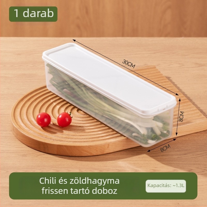 Hosszú, átlátszó hűtőszekrényben tároló doboz korianderrel, teljes újhagyma, tészta és tojásokkal