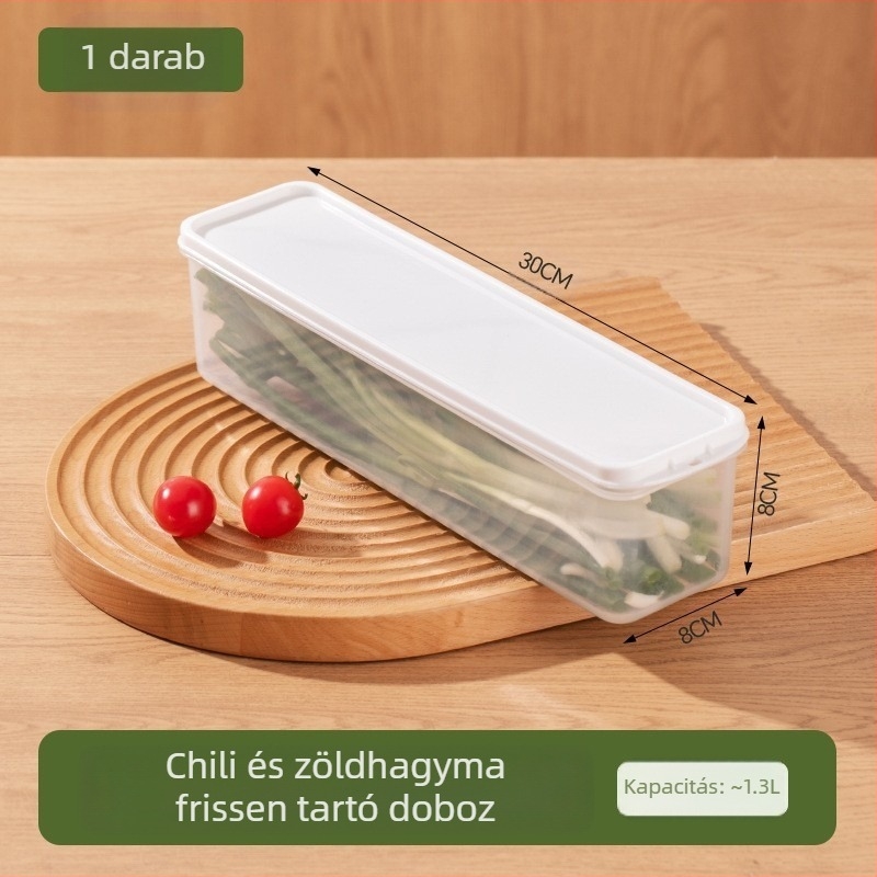 Hosszú, átlátszó hűtőszekrényben tároló doboz korianderrel, teljes újhagyma, tészta és tojásokkal