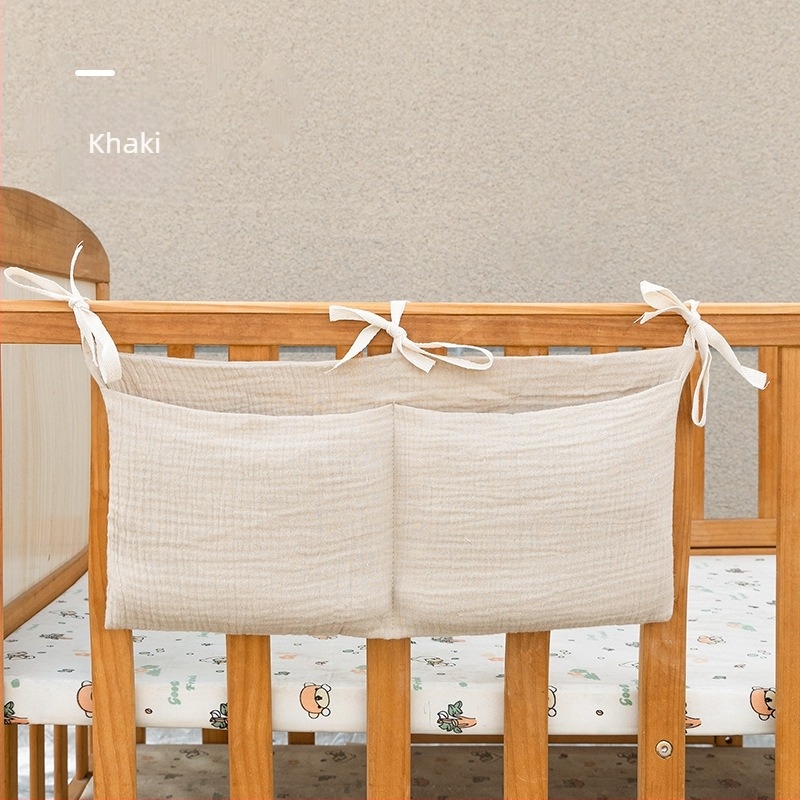 Kétszintű pamut baba oldalához tartozó tároló táska, két zsebbel, akasztva a babakocsira, nyomtatott mintával