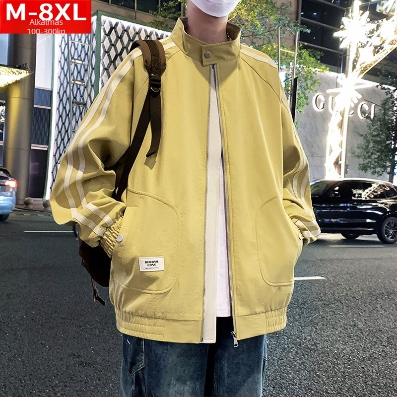 Álló galléros dzseki szalag részlettel, cipzárral, szélálló poliészter anyagból, lazán szabott