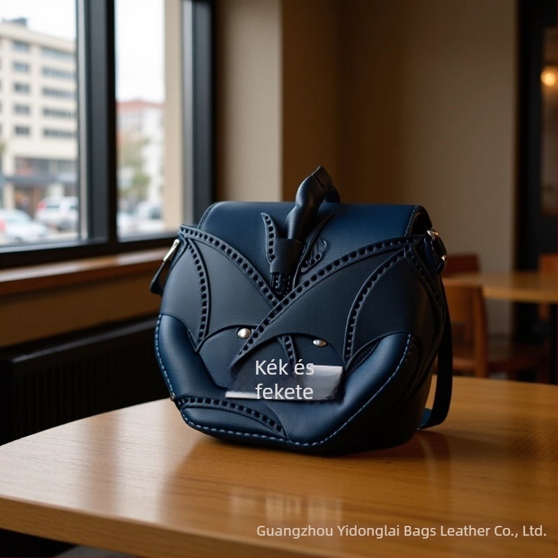 Dragon Wings PU keresztpántos crossbody táska — kerek forma, fedős záródás, városi egyszerű stílus