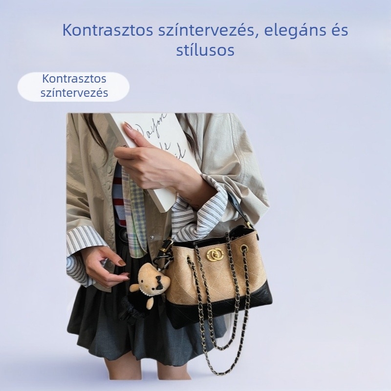 Velúr anyagú váll- és kereszttáska, vízszintes négyzetes forma, fedeles nyitás, belső cipzáras zseb