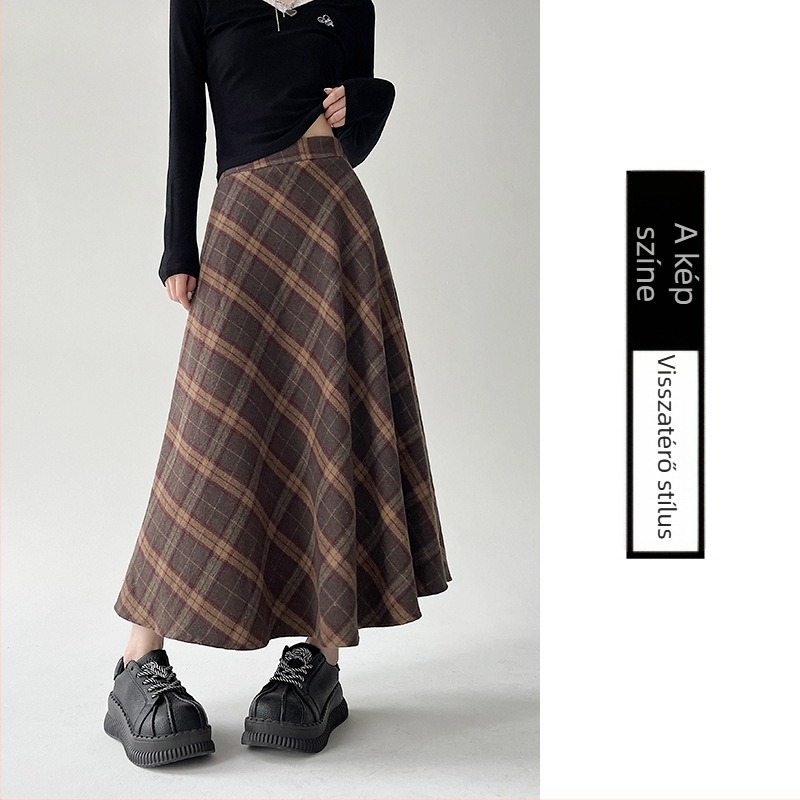 Középmagasságú, magas derekú esernyőszoknya csíkos/kockás mintával; poliészter anyag gyapjúkeverékkel és 30% alatti pamut tartalommal; mikro-elasztikusság; őszi-téli 2025